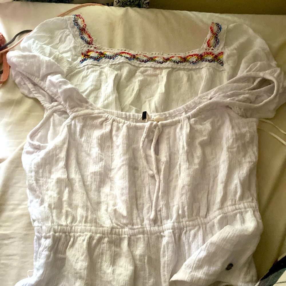 Two white shirts, both stretchy